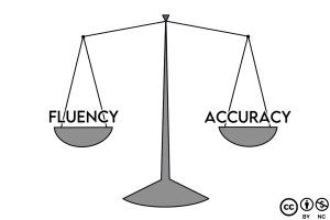 A comic-style illustration of a scale with 'Fluency' on one side and 'Accuracy' on the other, shows that both need to be balanced and are equally important.