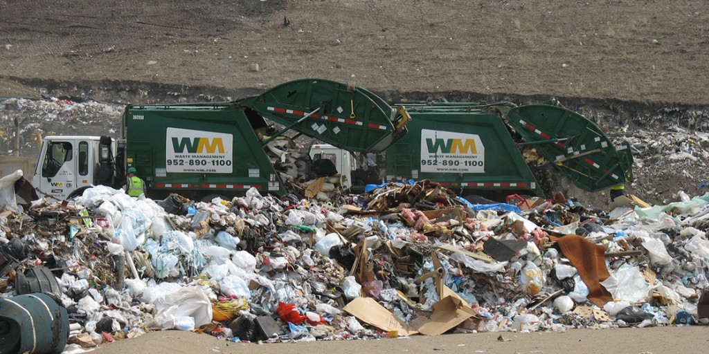 a garbage truck in a dump.