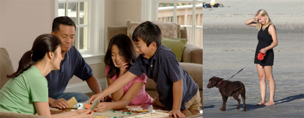 an Asian family playing Monopoly and a Caucasian female walking a dog by herself